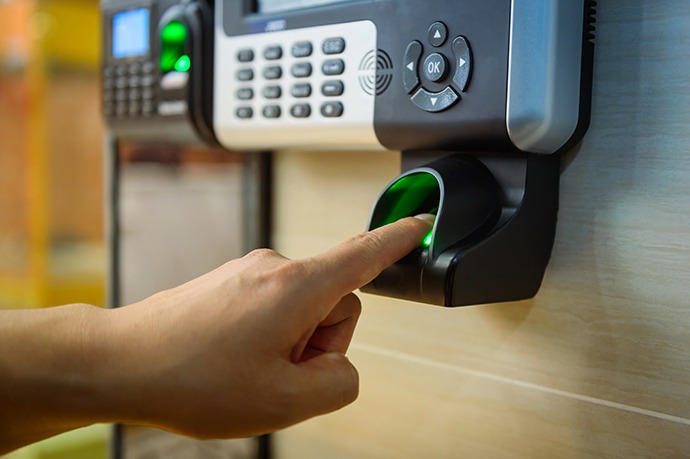 a person using a biometric access control system with fingerprint access