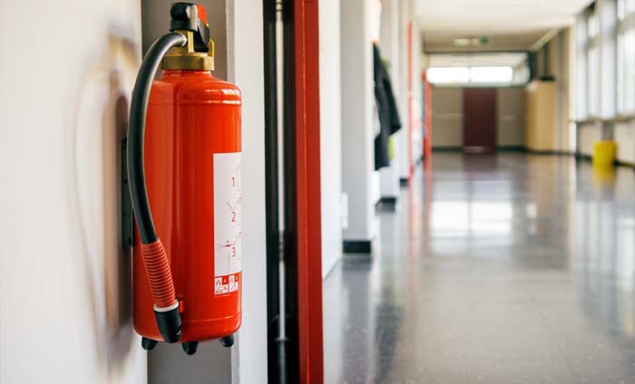 Fire extinguisher in school hallway