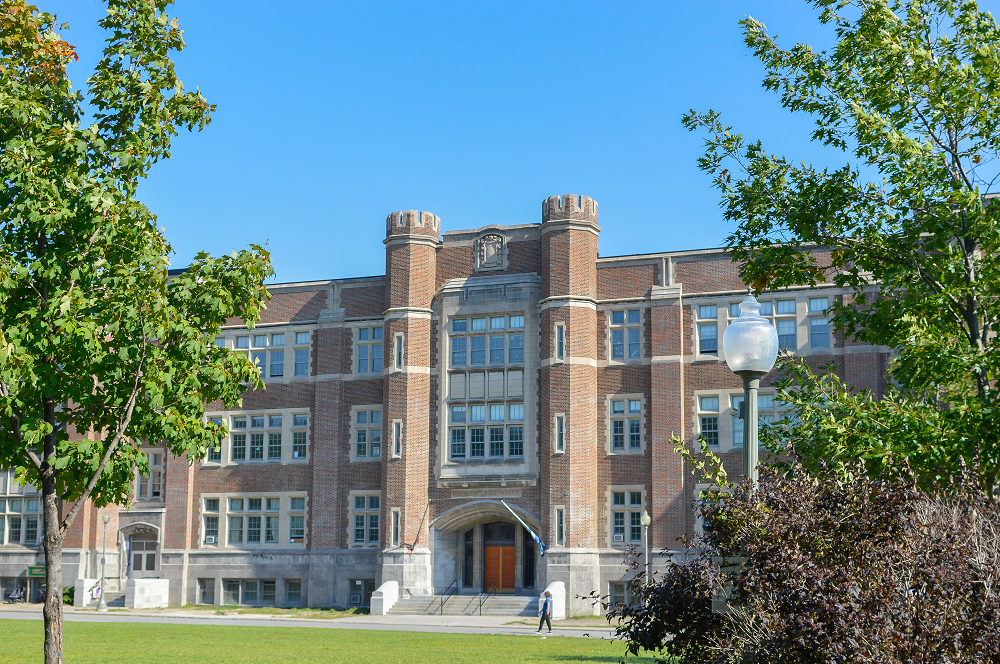 an exterior view of a large school in Surrey